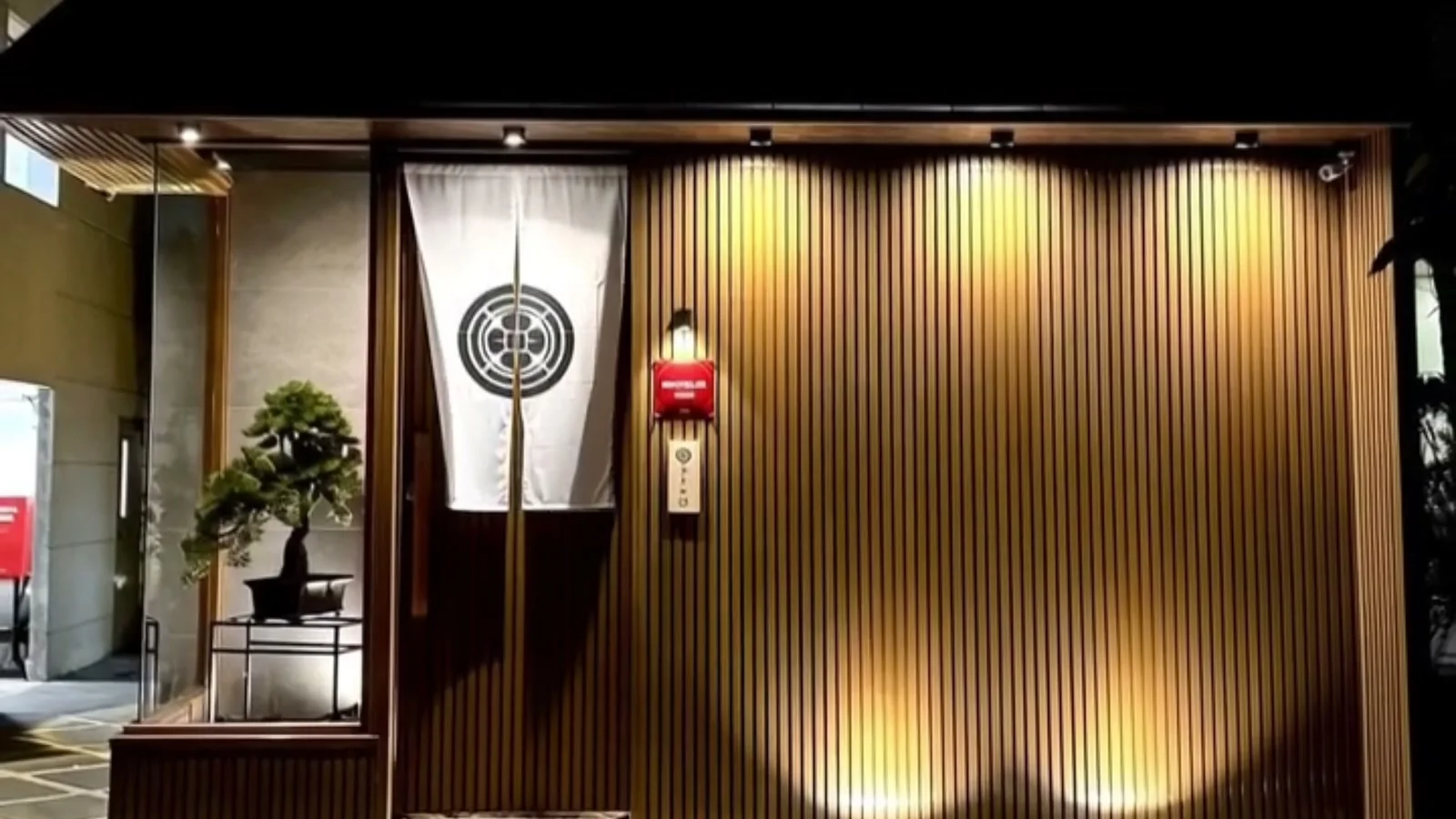 Illuminated entrance of Torisawa 22 in Bangkok