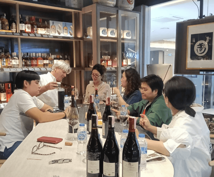 Guests taking part in a wine tasting at Atelier Nadaya