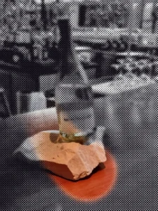 Moving dot illustration of the bottle photo from “Advice from a Sommelier “Meilleur Ouvrier de France”, “Best Workman of France”, for successful food and wine pairing.”; a drifting circle reveals the original picture